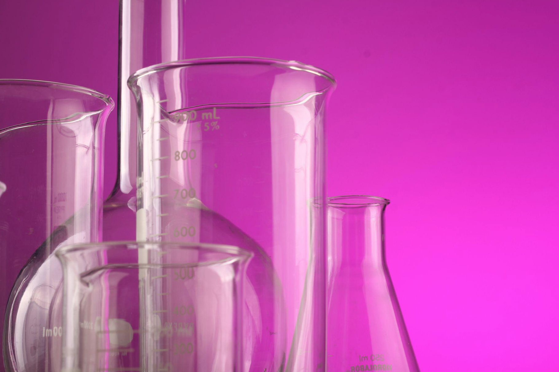 A-set-of-laboratory-test-tubes-with-a-purple-background